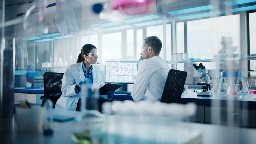 Modern Medical Research Laboratory: Two Scientists Working