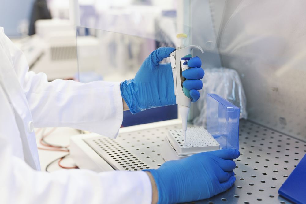 Lab Technician Working With Pipette In Molecular Laboratory